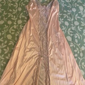 A long satin rose pink lingerie slip with a long slit down the middle.